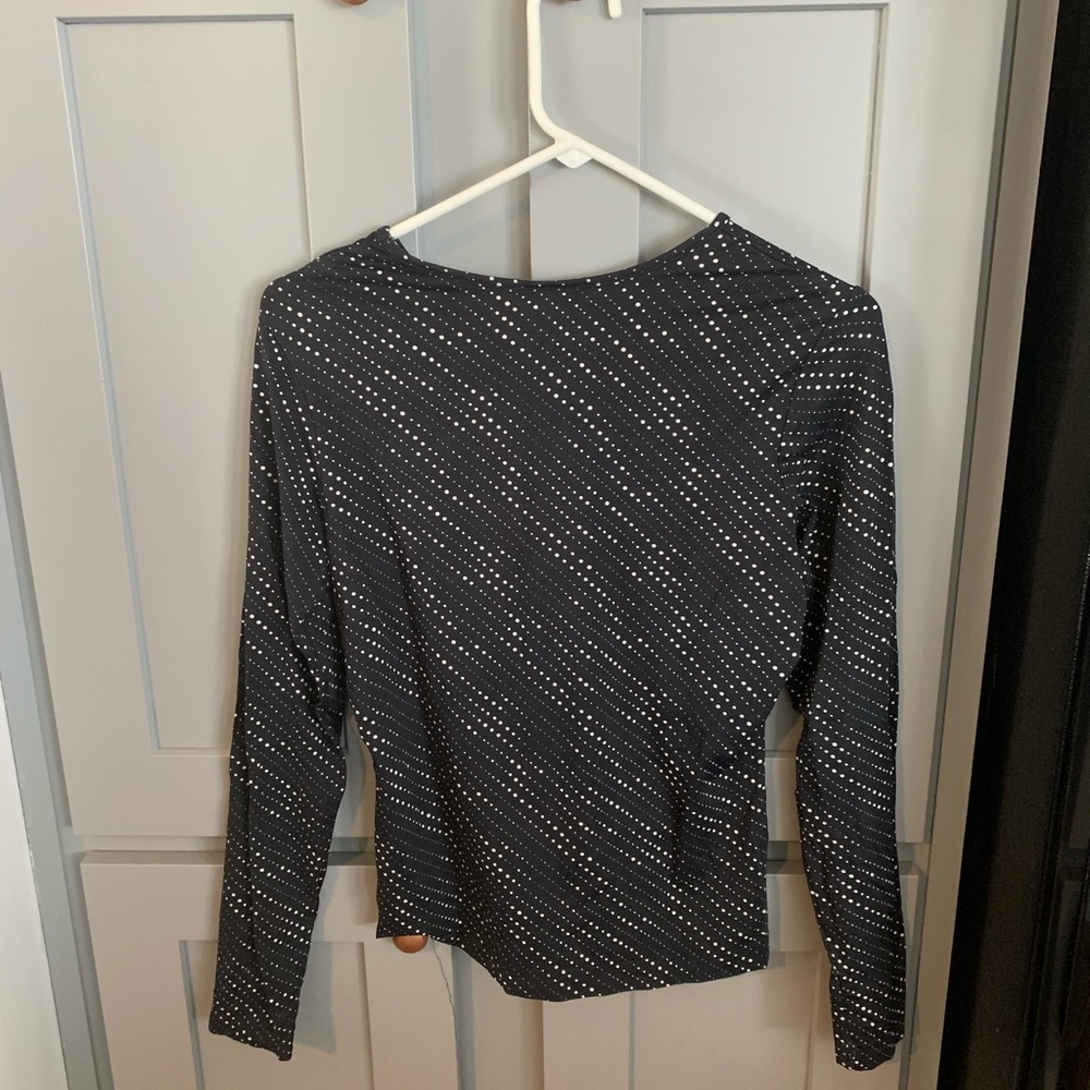 The limited black long sleeve polkadotted shirt